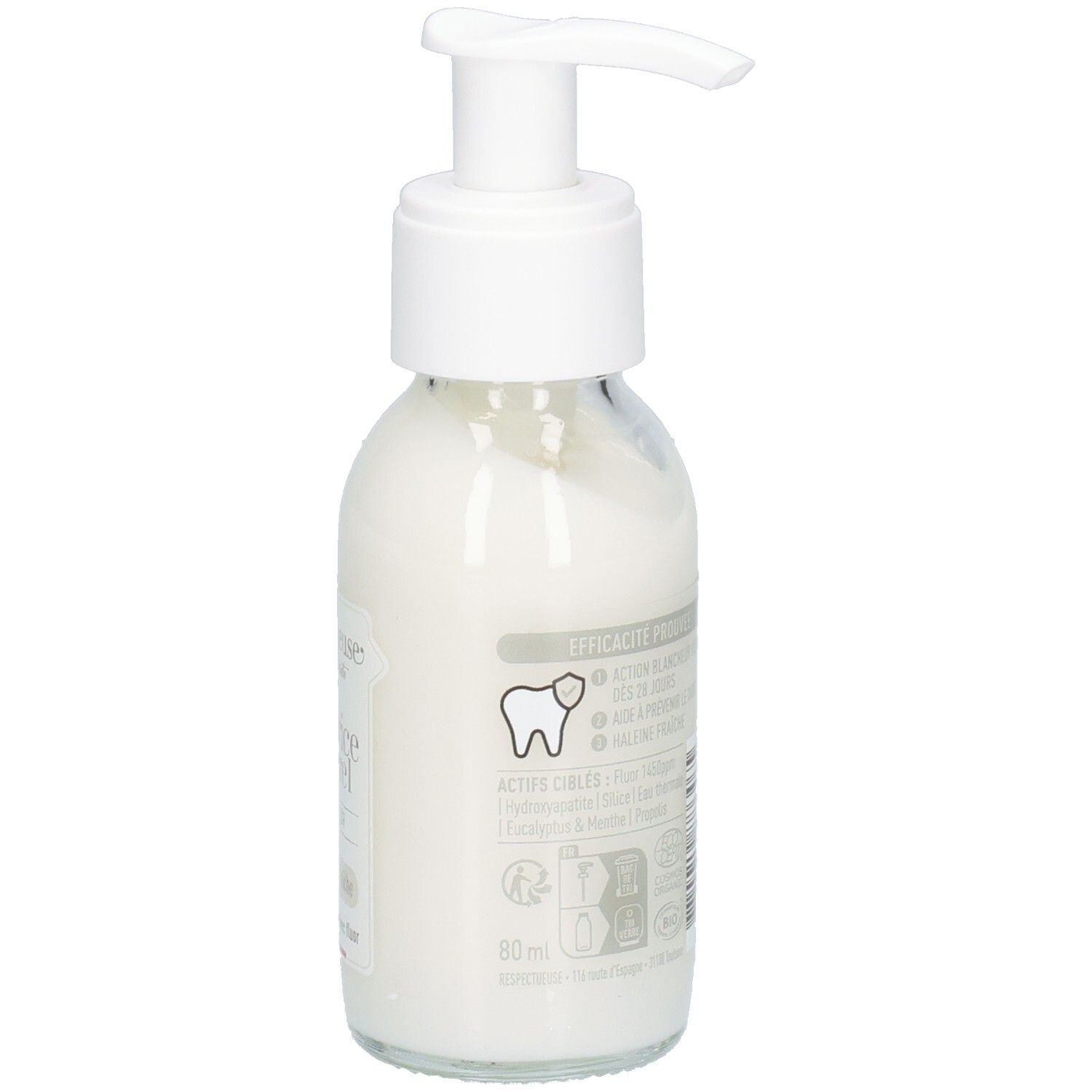 Glazen fles met witte inhoud en pomp. Opschriften en symbolen. Etiket met informatie.