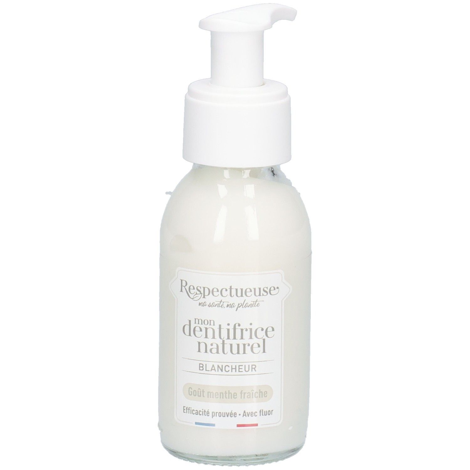 Glazen fles met witte inhoud en pomp. Opschrift: "Respectueuse mon dentifrice naturel blancheur". Smaak: frisse munt.