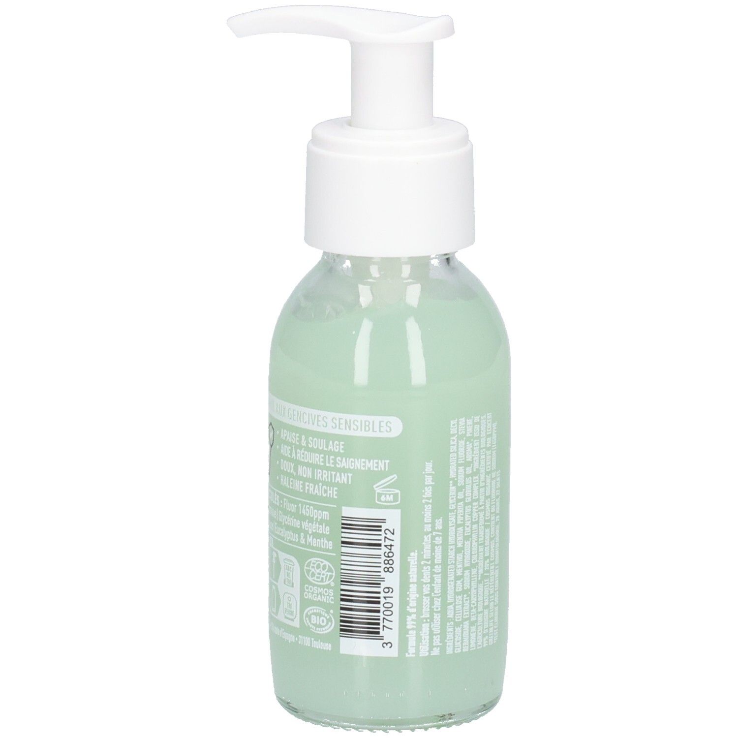 Glazen fles met witte pomp, groene vloeistof. Etiket met tekst en barcode. Achteraanzicht.