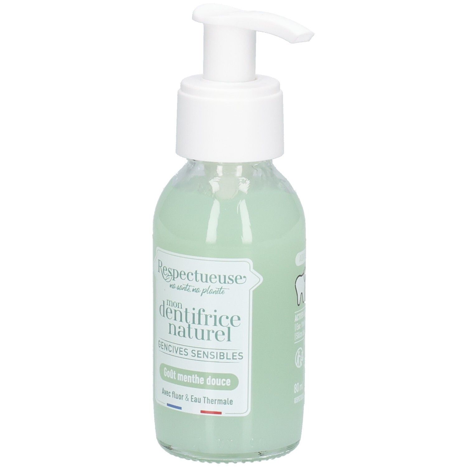 Glazen fles met witte pomp, groene vloeistof. Label: "Respectueuse", "dentifrice naturel", "Gencives sensibles". Tand-icoon.