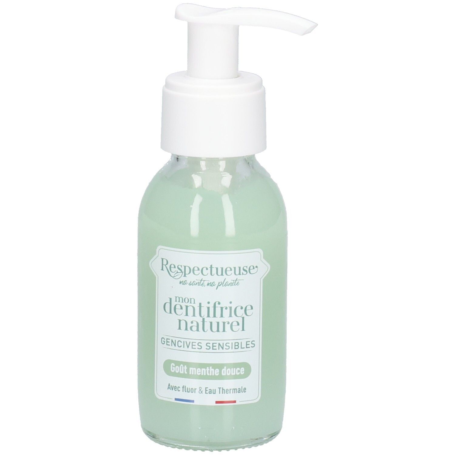 Glazen fles met witte pomp, groene vloeistof. Label: "Respectueuse", "dentifrice naturel", "Gencives sensibles". Franse vlag.