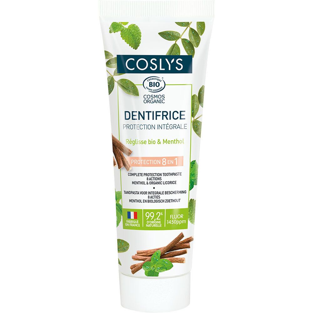 Coslys tandpastatube met groene bladeren en tekst "Dentifrice Protection Intégrale". Bevat bio-certificering. Met afbeeldingen van kaneelstokjes.