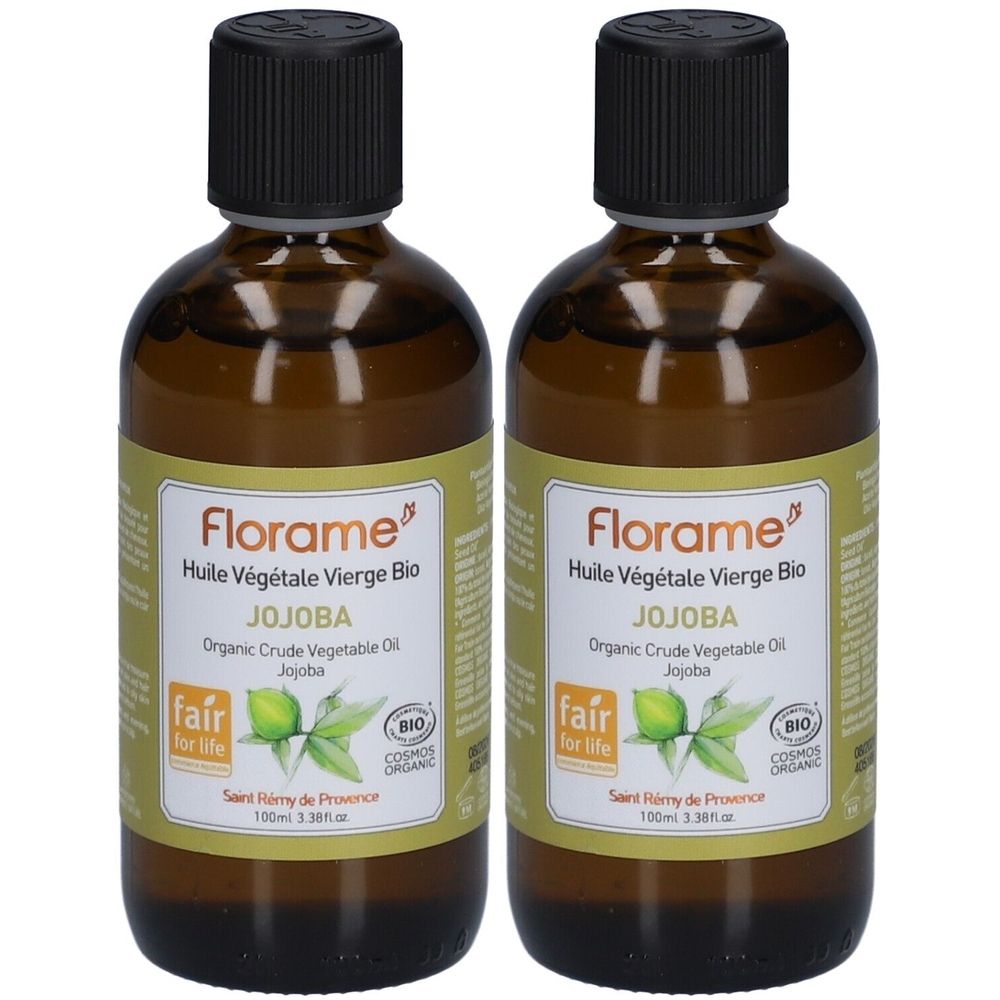 Twee bruine glazen flessen met zwarte dop. Etiket met tekst: Florame, Jojoba, bio-certificering, Fair for Life.