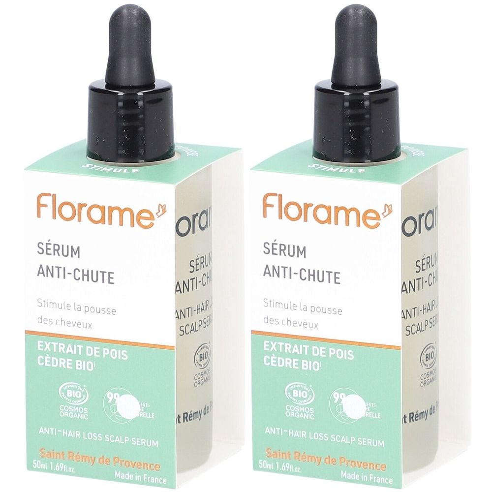 Twee flessen Florame Sérum Anti-Chute met druppelaar en verpakking. Opschrift: Sérum Anti-Chute, Extrait de pois cèdre bio.
