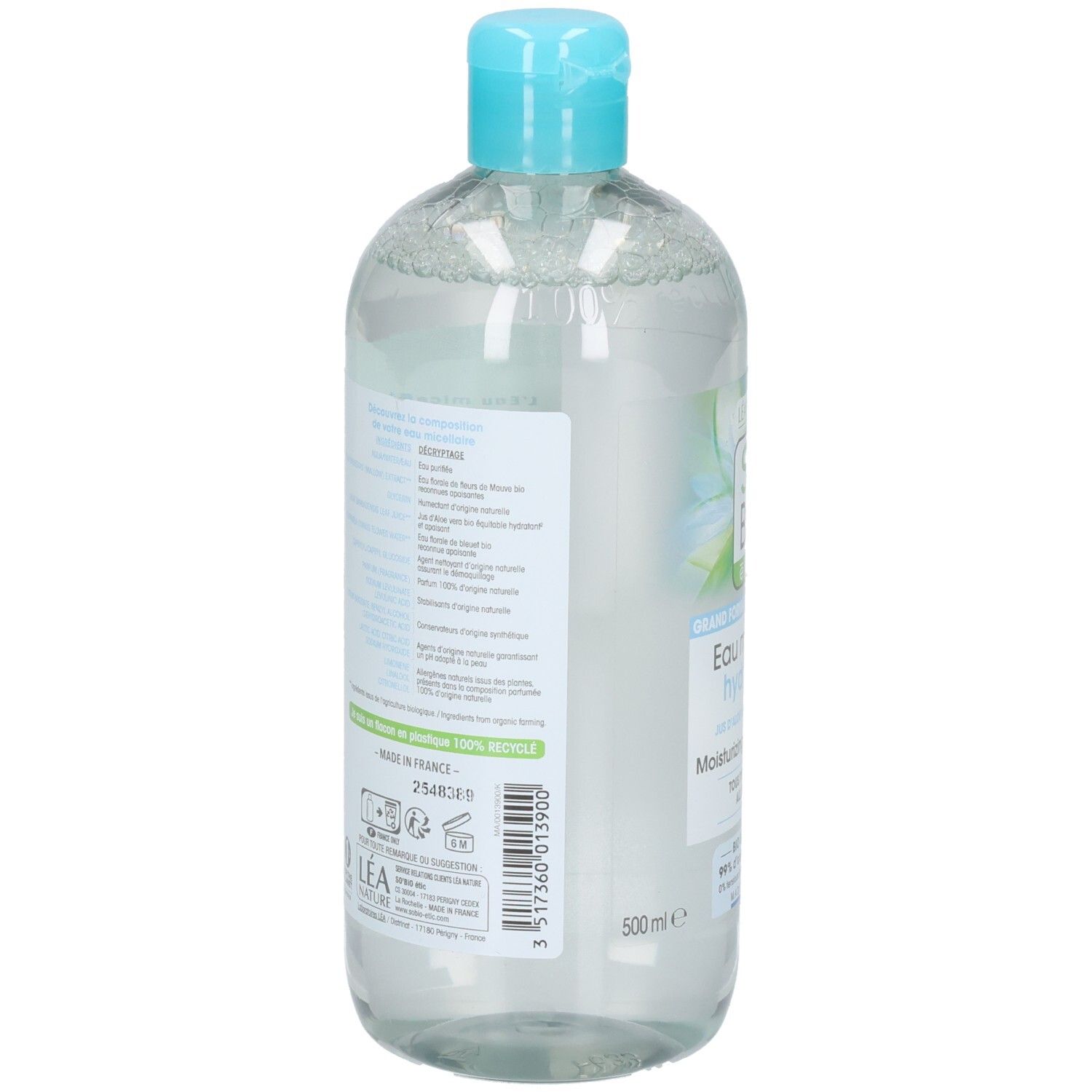 Achterkant van de fles. Meertalige tekst. Informatie over ingrediënten en fabrikant.
