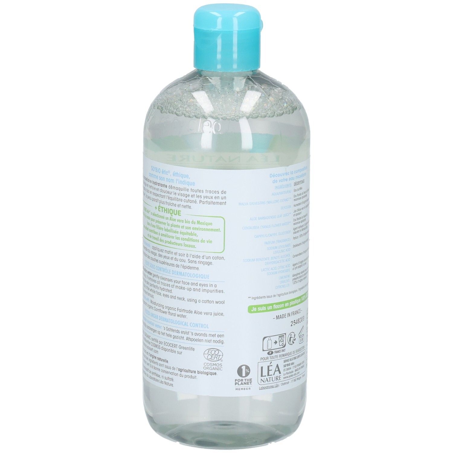 Achterkant van de fles. Meertalige tekst. Informatie over ingrediënten en fabrikant.