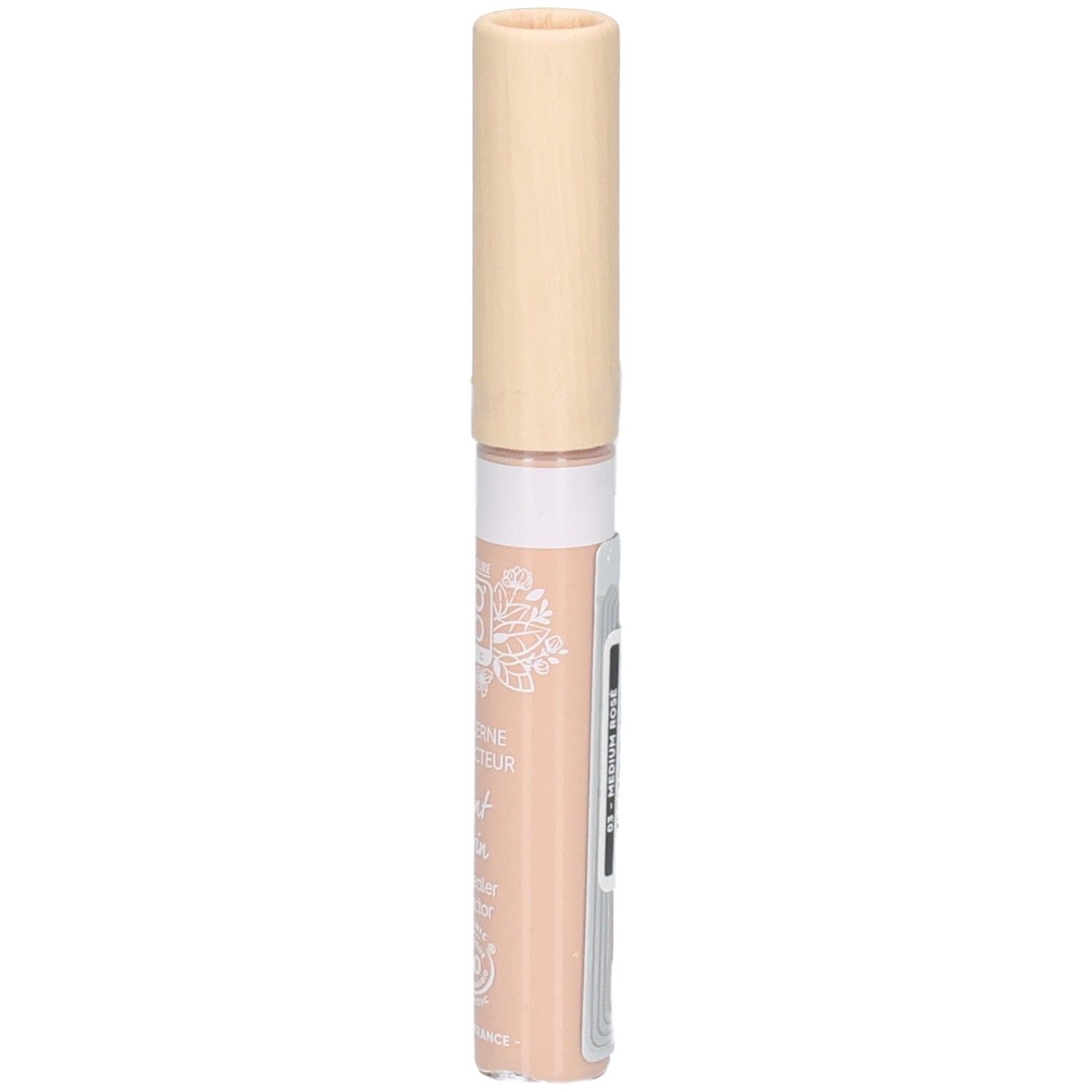 Correcteur de teint avec bouchon beige. Étiquette latérale avec texte. Couleur: rosé.