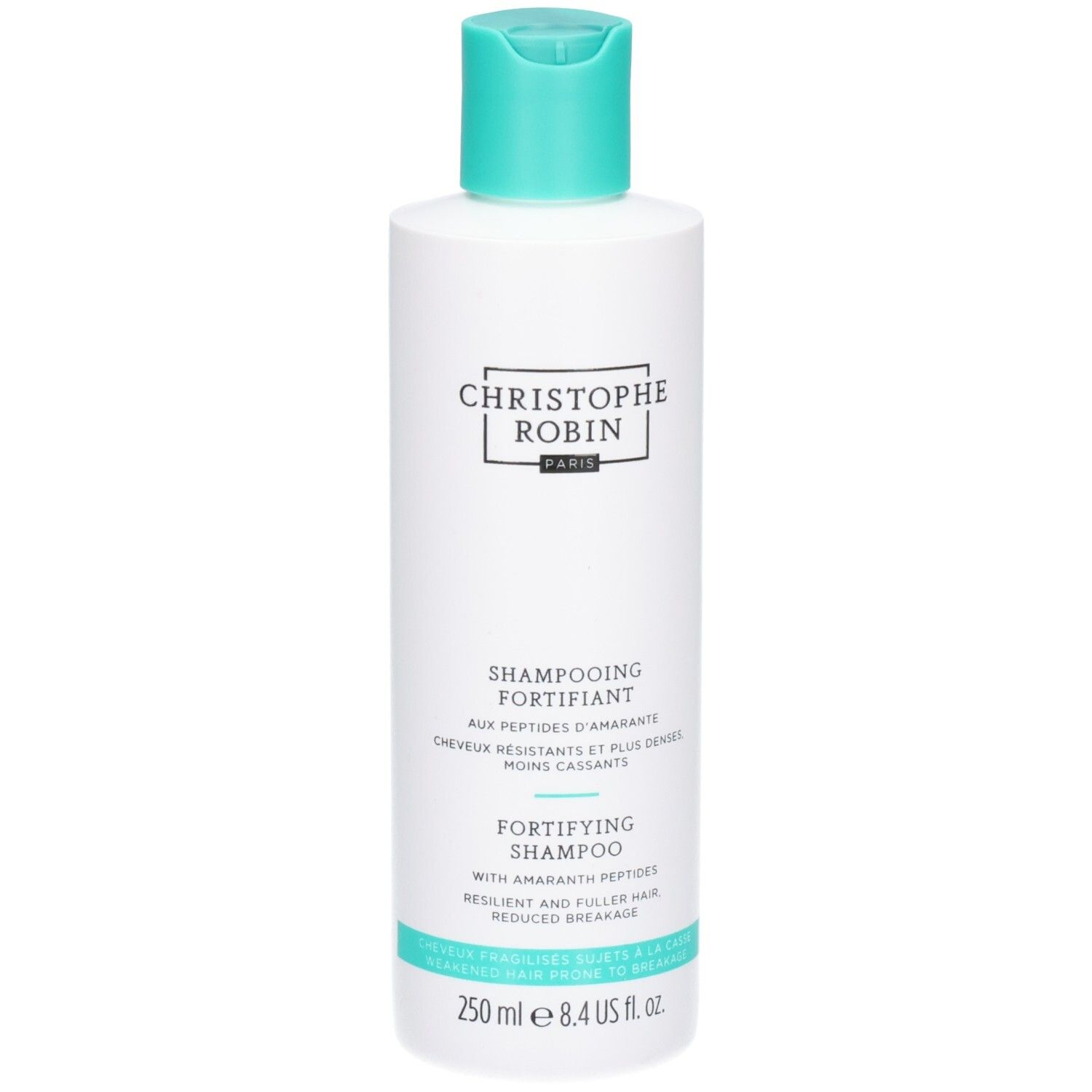 Witte fles met turquoise dop. Opschrift: Christophe Robin, Shampooing Fortifiant, Fortifying Shampoo.
