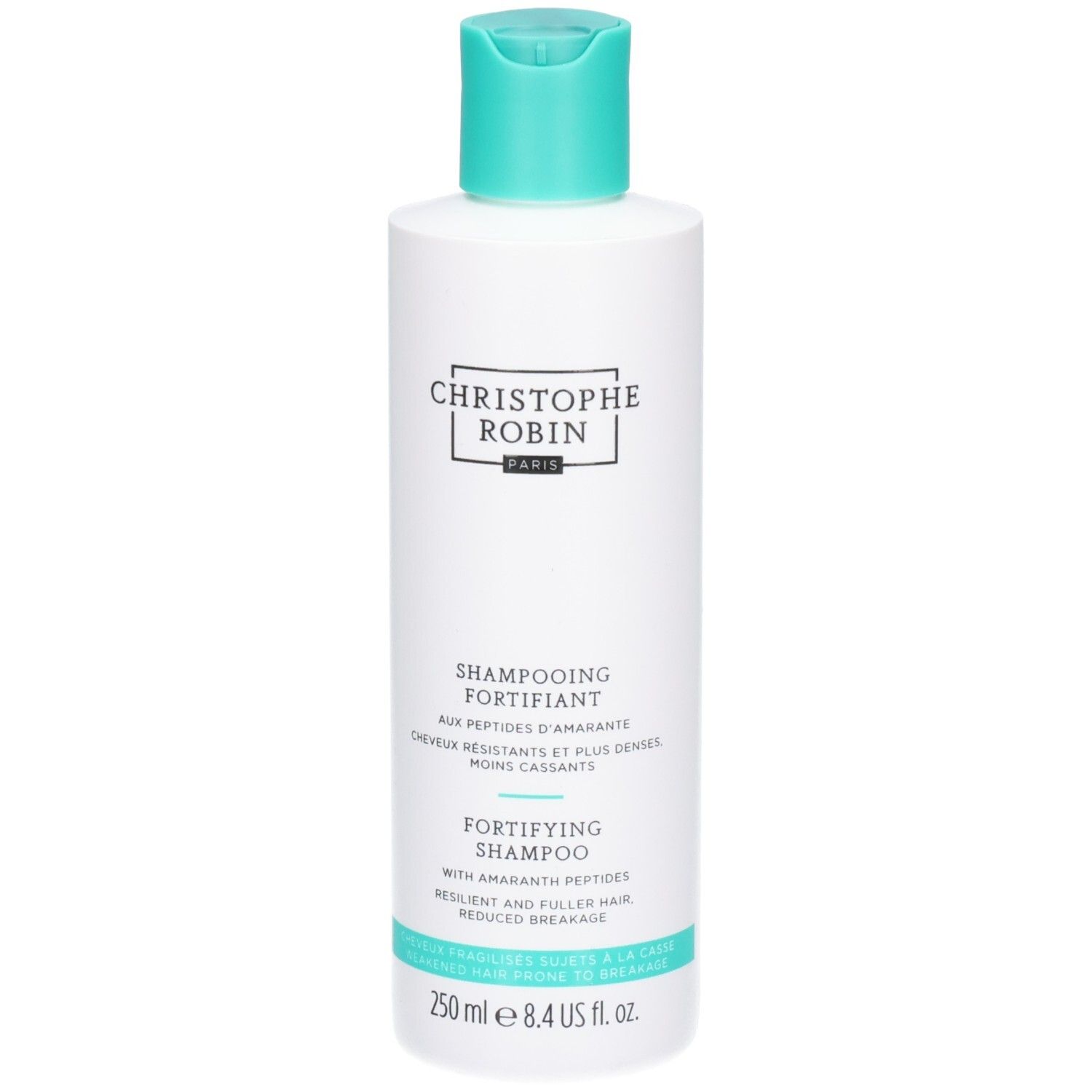 Witte fles met turquoise dop. Opschrift: Christophe Robin, Shampooing Fortifiant, Fortifying Shampoo.