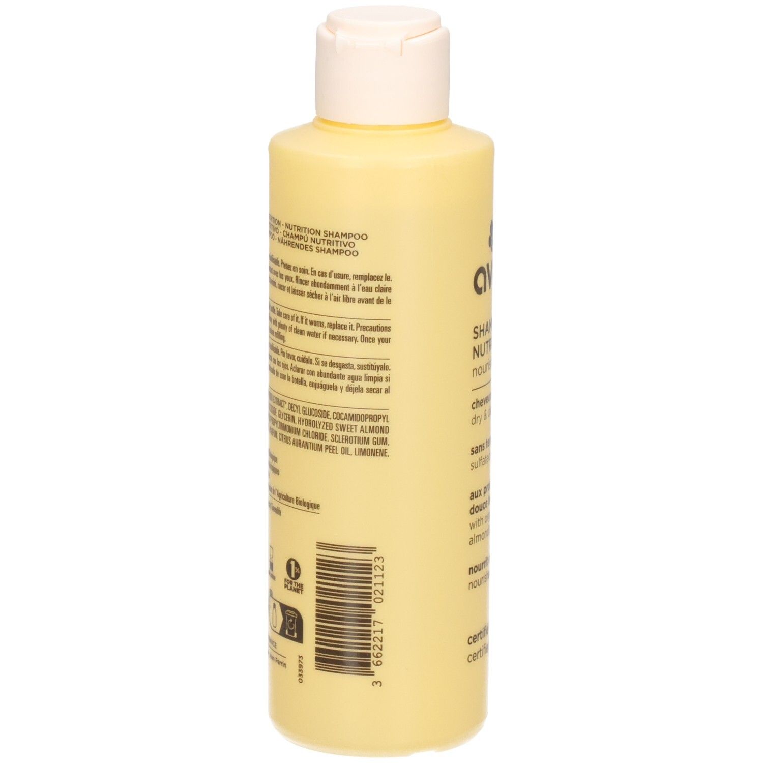 Lichtgele shampoofles met witte fliptopdop. Etiket met tekst en barcode.