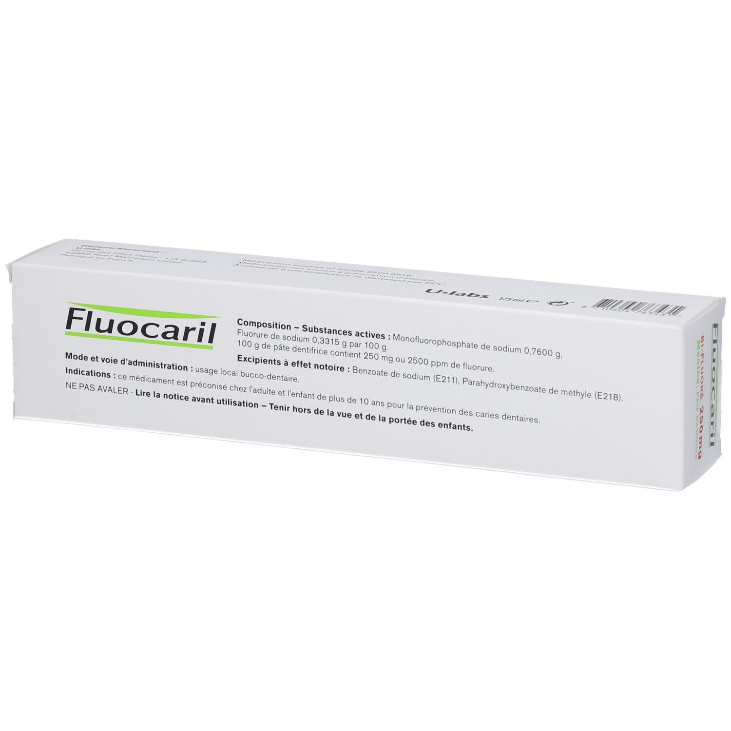 Boîte de dentifrice blanche et verte. Inscription Fluocaril, ingrédients et instructions d'utilisation.