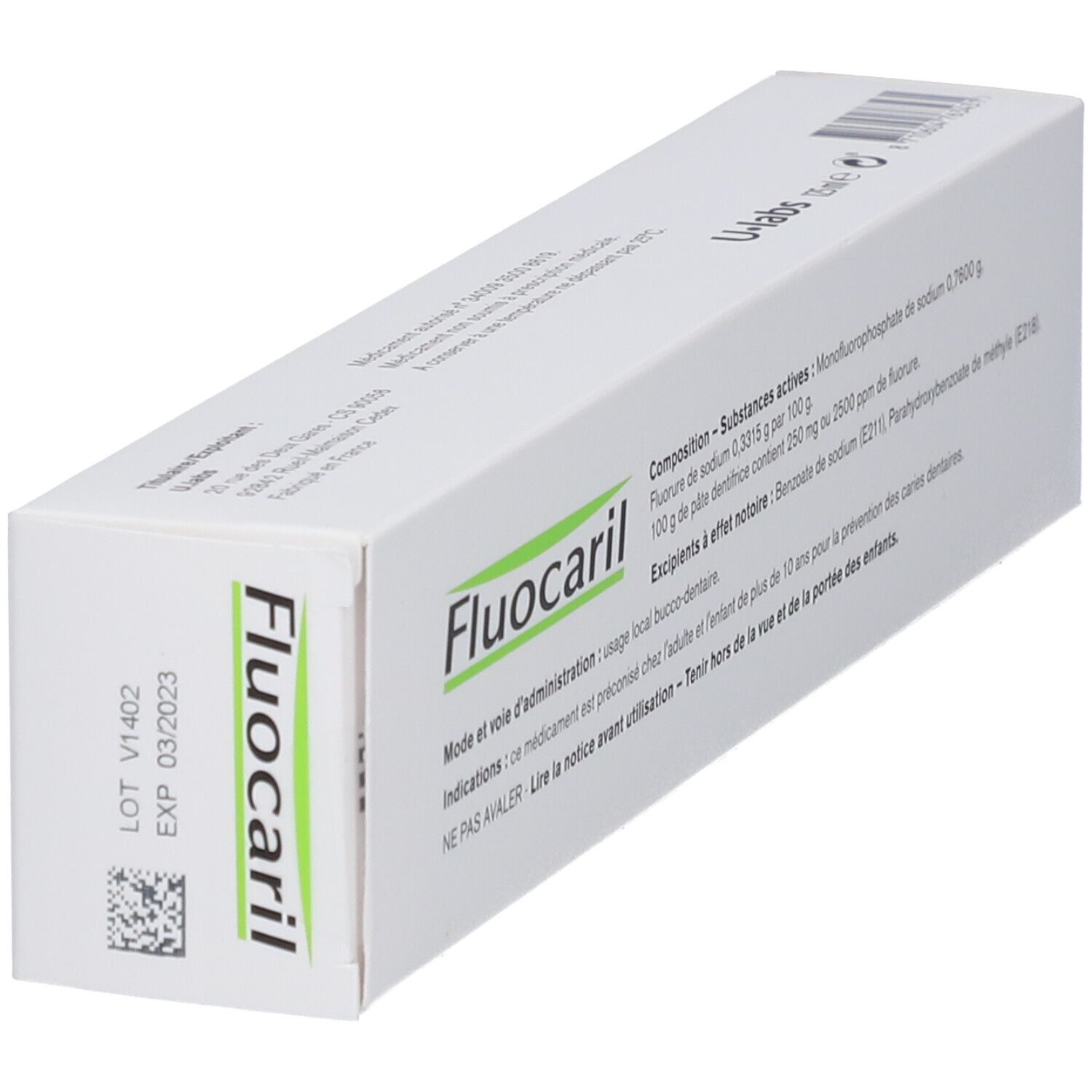Boîte de dentifrice blanche et verte. Inscription Fluocaril, ingrédients et instructions d'utilisation.