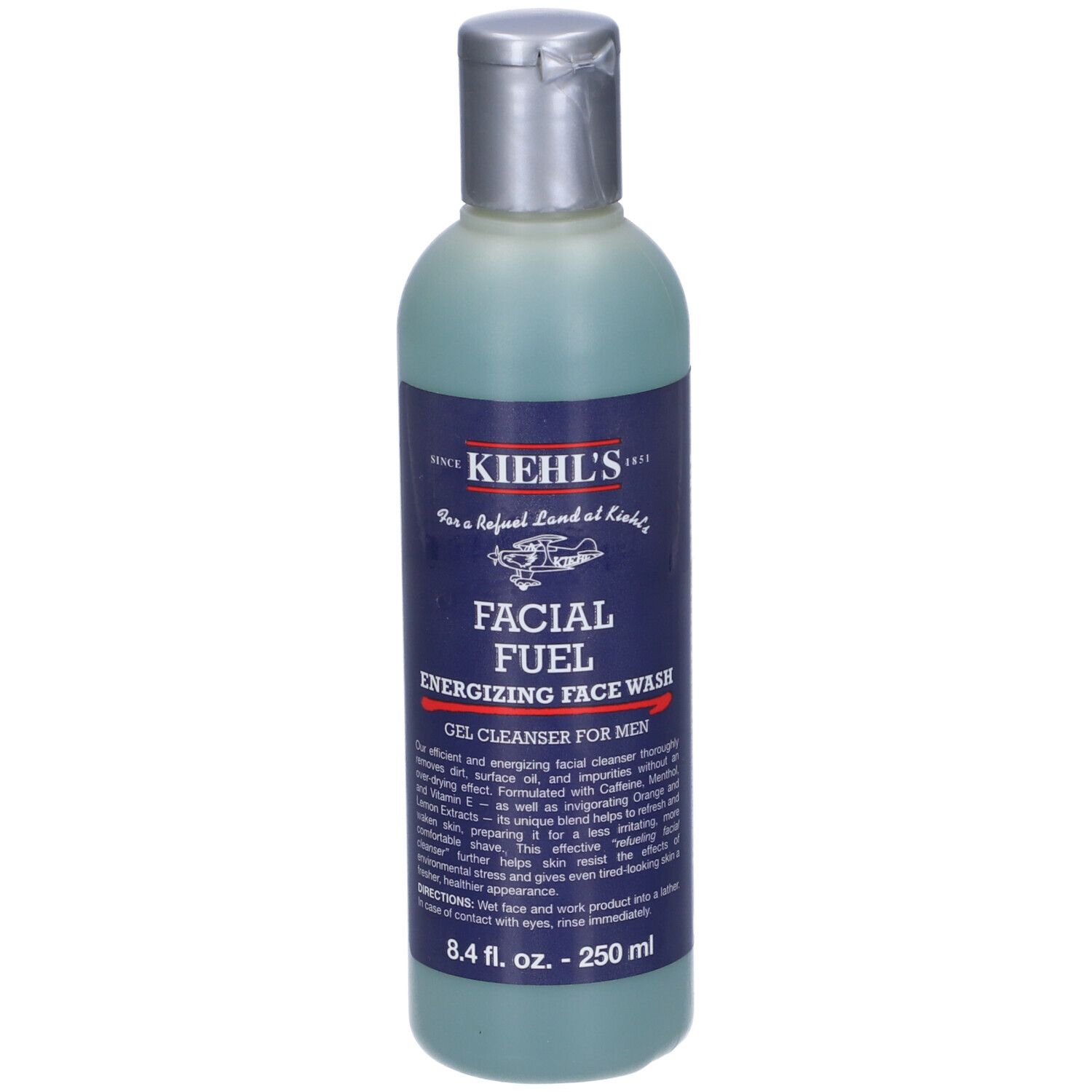 Flacon de nettoyant visage bleu-vert. L'étiquette indique "FACIAL FUEL" et "KIEHL'S".