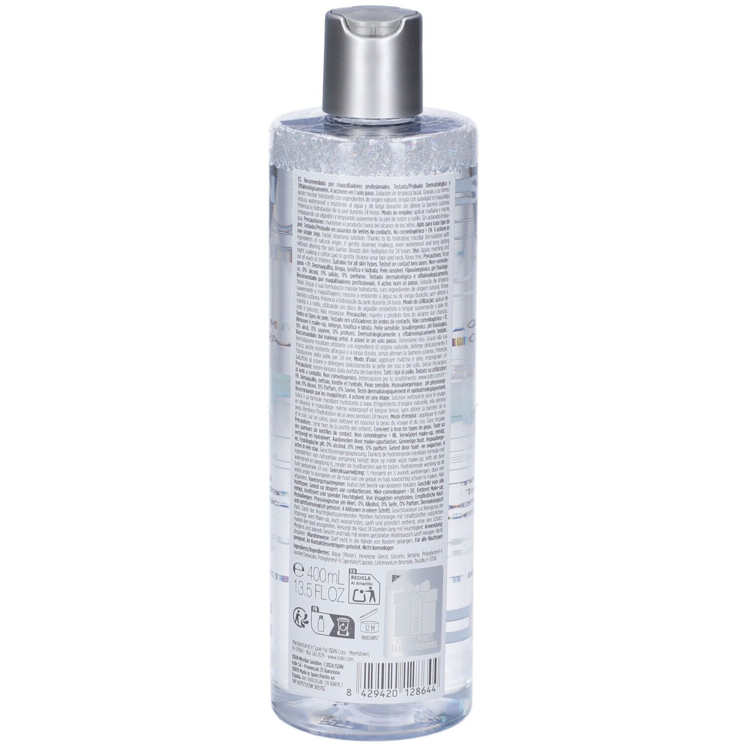 Liquide clair dans une bouteille transparente avec un bouchon argenté et une étiquette d'informations produit et code-barres.