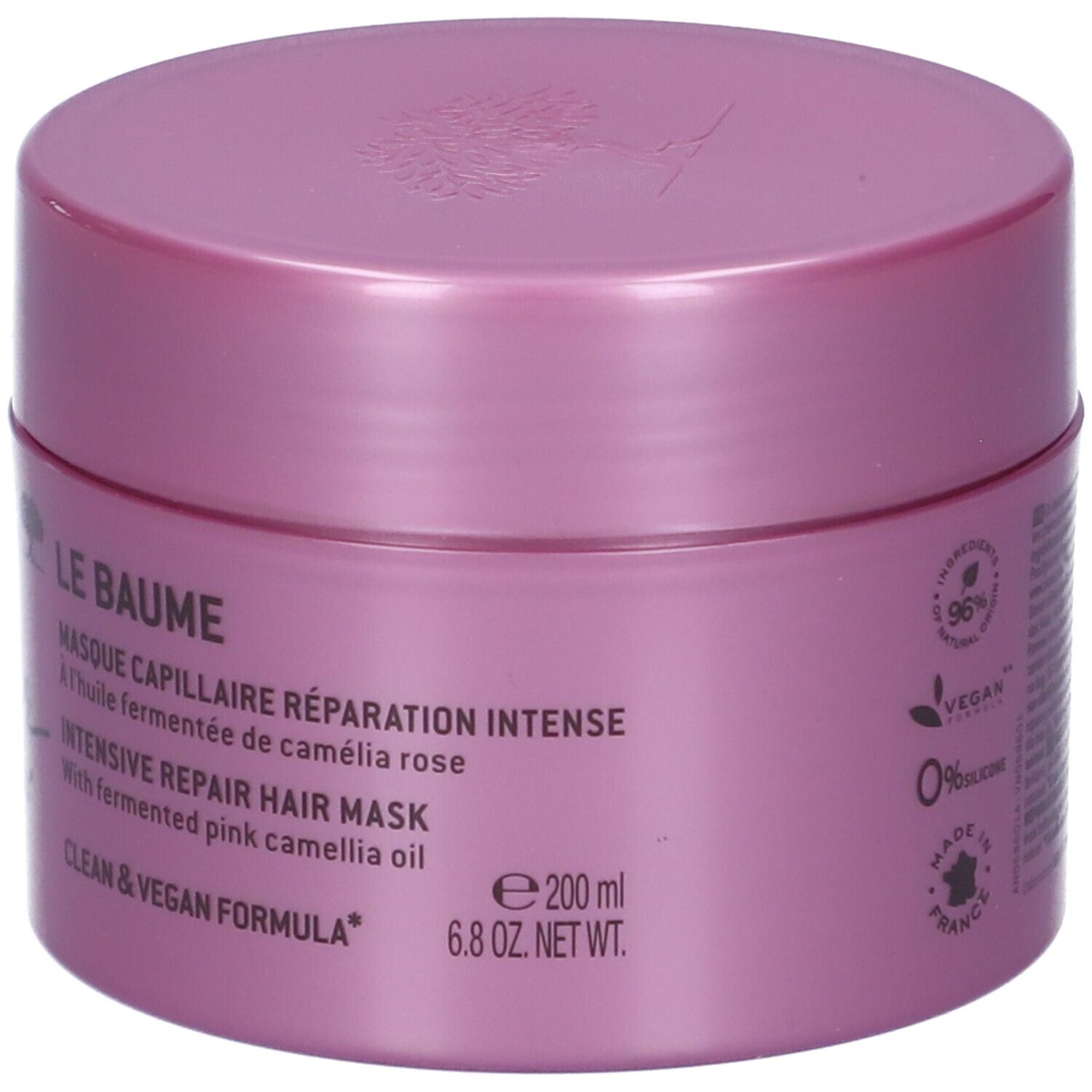 Un pot rose de masque capillaire de 200 ml. Contient de l'huile de camélia rose fermentée. Formule végane.