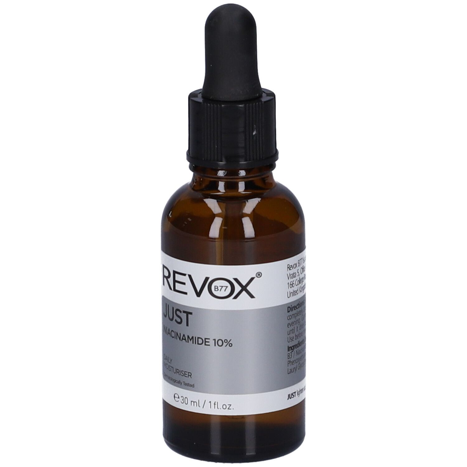 Flacon en verre brun avec compte-gouttes noir. Étiquette avec informations produit. Revox B77 Just Niacinamide 10%.