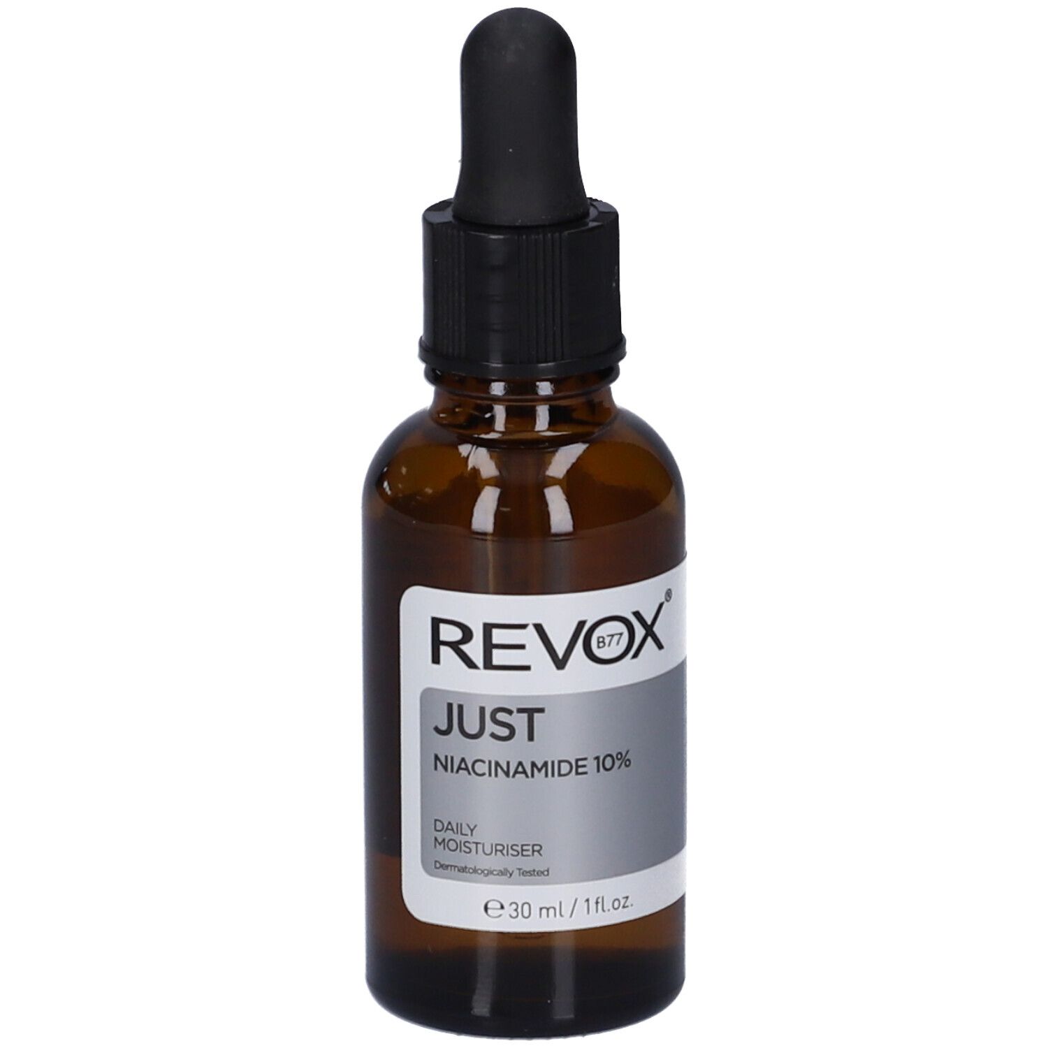 Flacon en verre brun avec compte-gouttes noir. Étiquette avec informations produit. Revox B77 Just Niacinamide 10%.