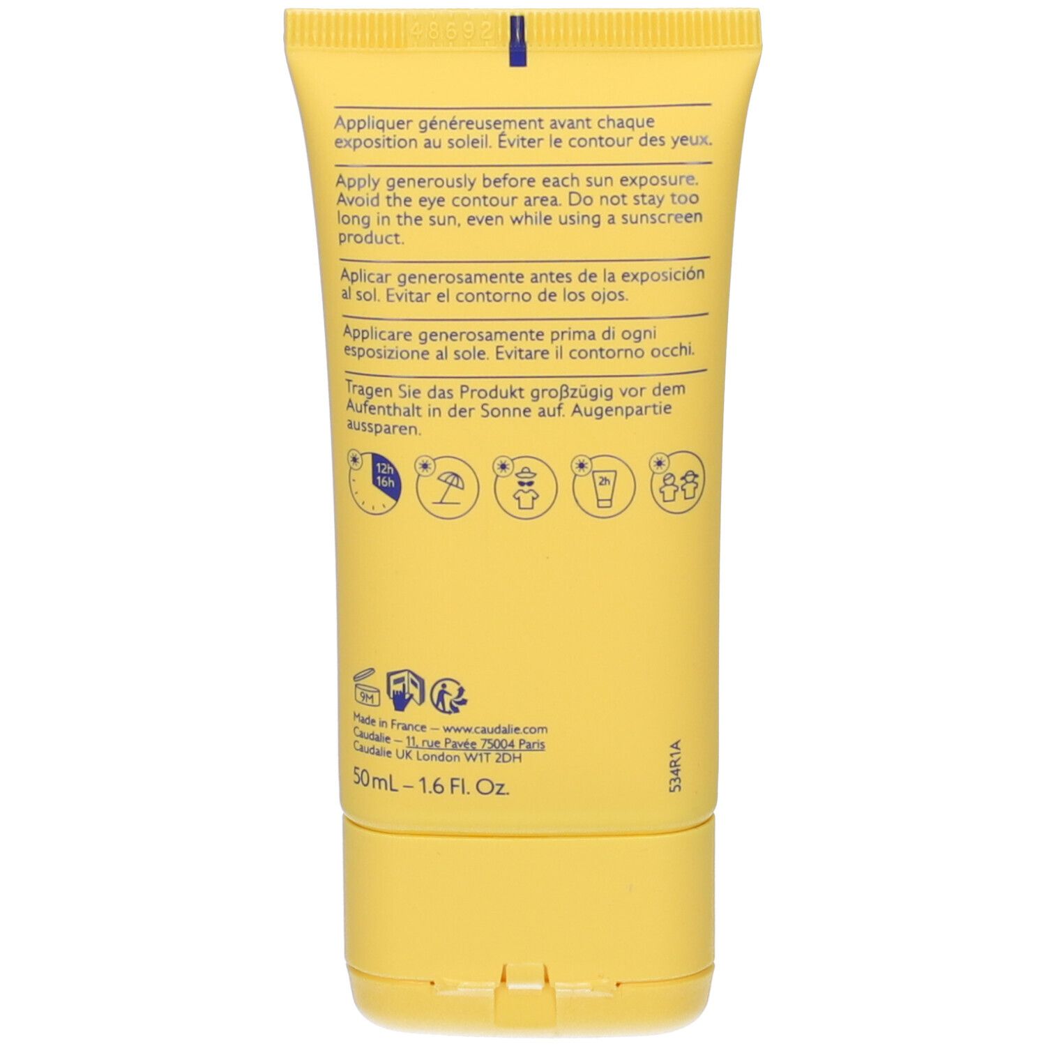 Dos du tube jaune. Texte multilingue, pictogrammes et informations de contact.
