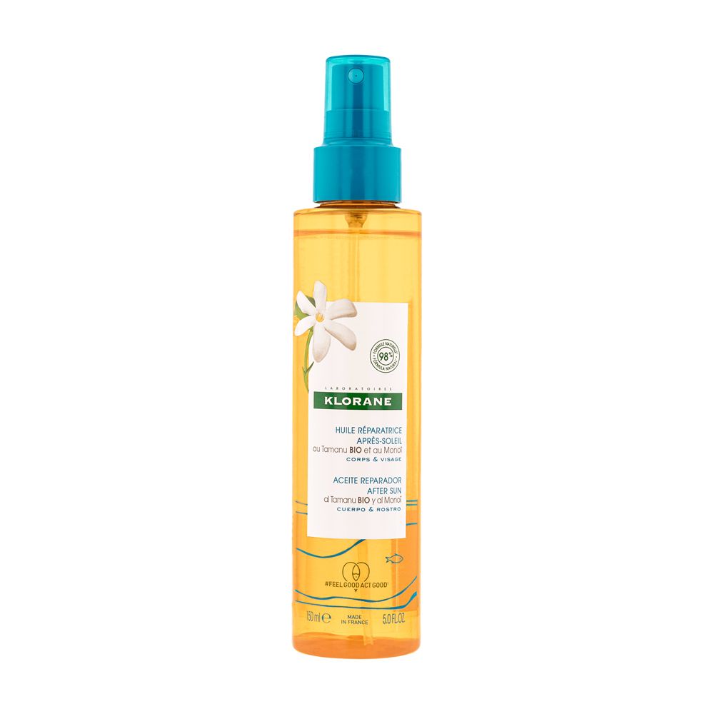 Flacon spray Klorane. Liquide jaune, bouchon bleu. Inscription: Huile réparatrice après-soleil.