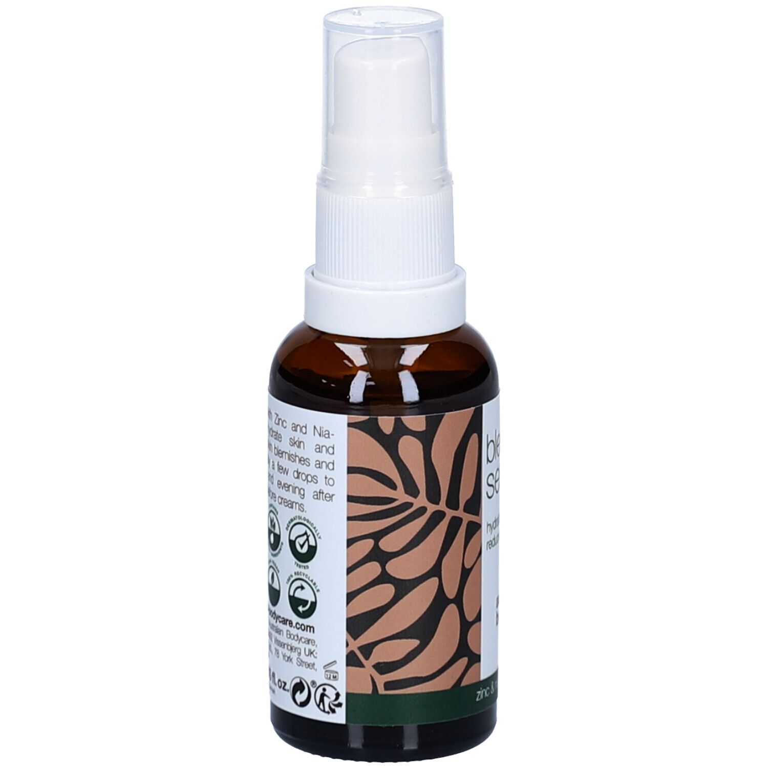 Flacon marron avec pompe blanche. Inscription : Blemish Serum. Texte au dos.