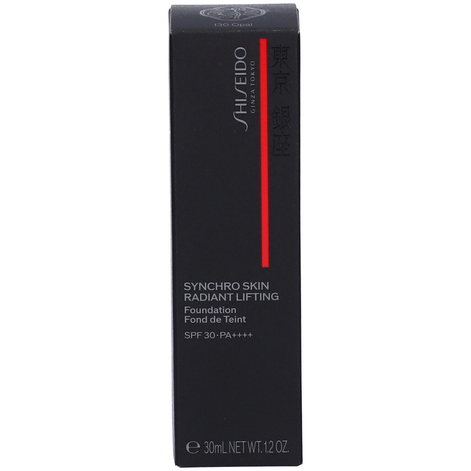 Emballage noir avec nom du produit, marque et indication SPF. Bande rouge.