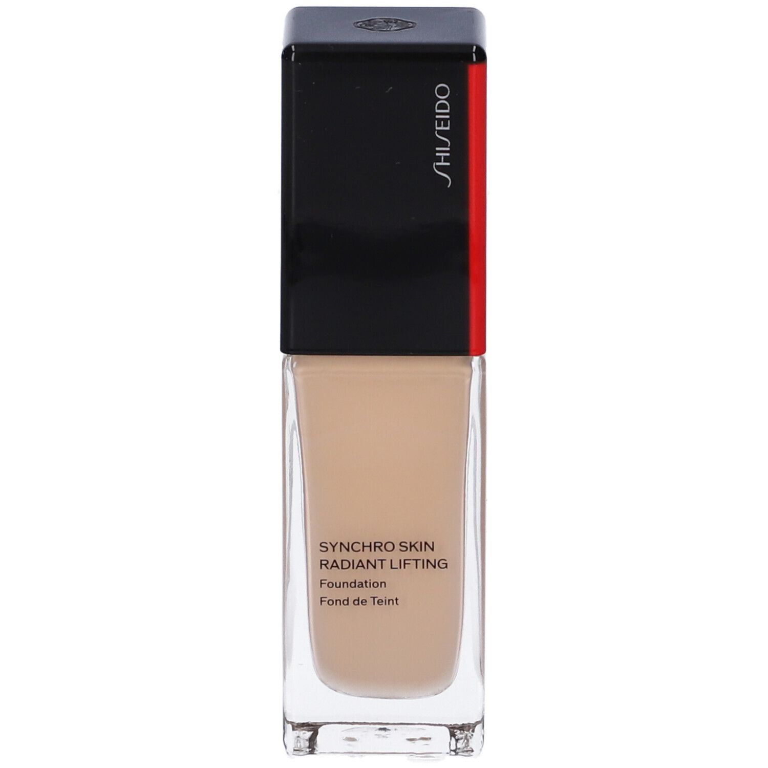 Flacon de fond de teint beige. Bouchon noir avec bande rouge. Inscription: Synchro Skin Radiant Lifting Foundation.