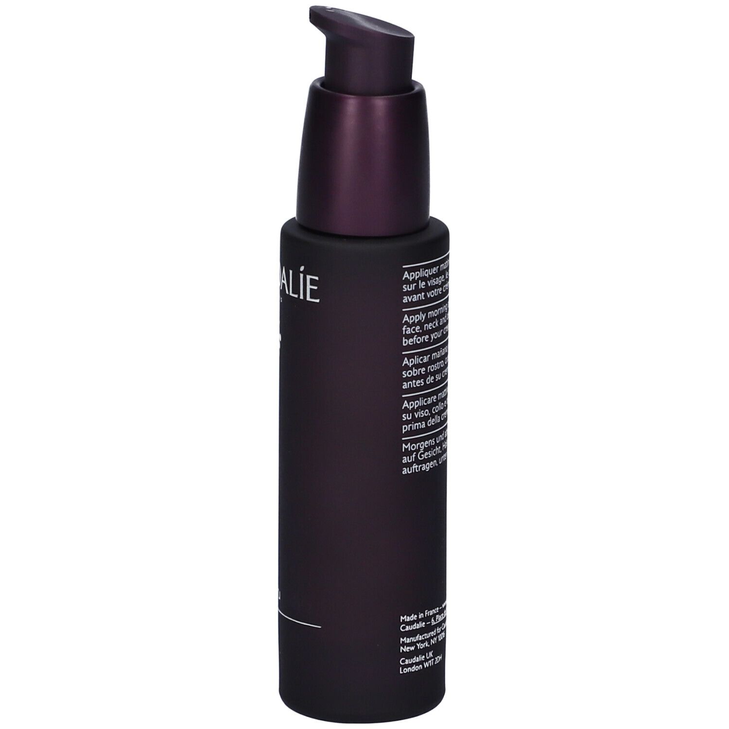 Flacon violet foncé avec pompe. Texte sur le flacon. Caudalie Premier Cru Le Sérum.