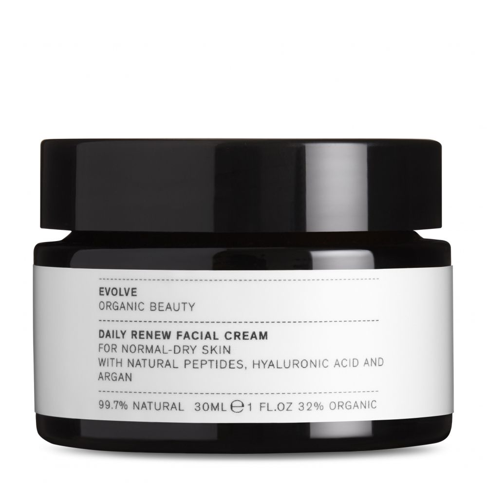 Pot noir avec étiquette blanche. Texte: Evolve, Daily Renew Facial Cream, pour peaux normales à sèches. Contient peptides, acide hyaluronique et argan.