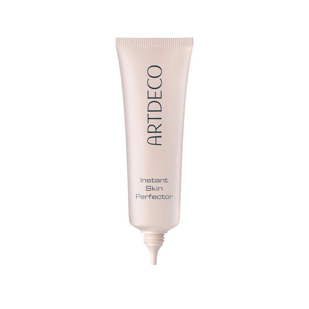 Tube de produit. Inscription ARTDECO, Instant Skin Perfector. Tube rose, pointe. Fond blanc.