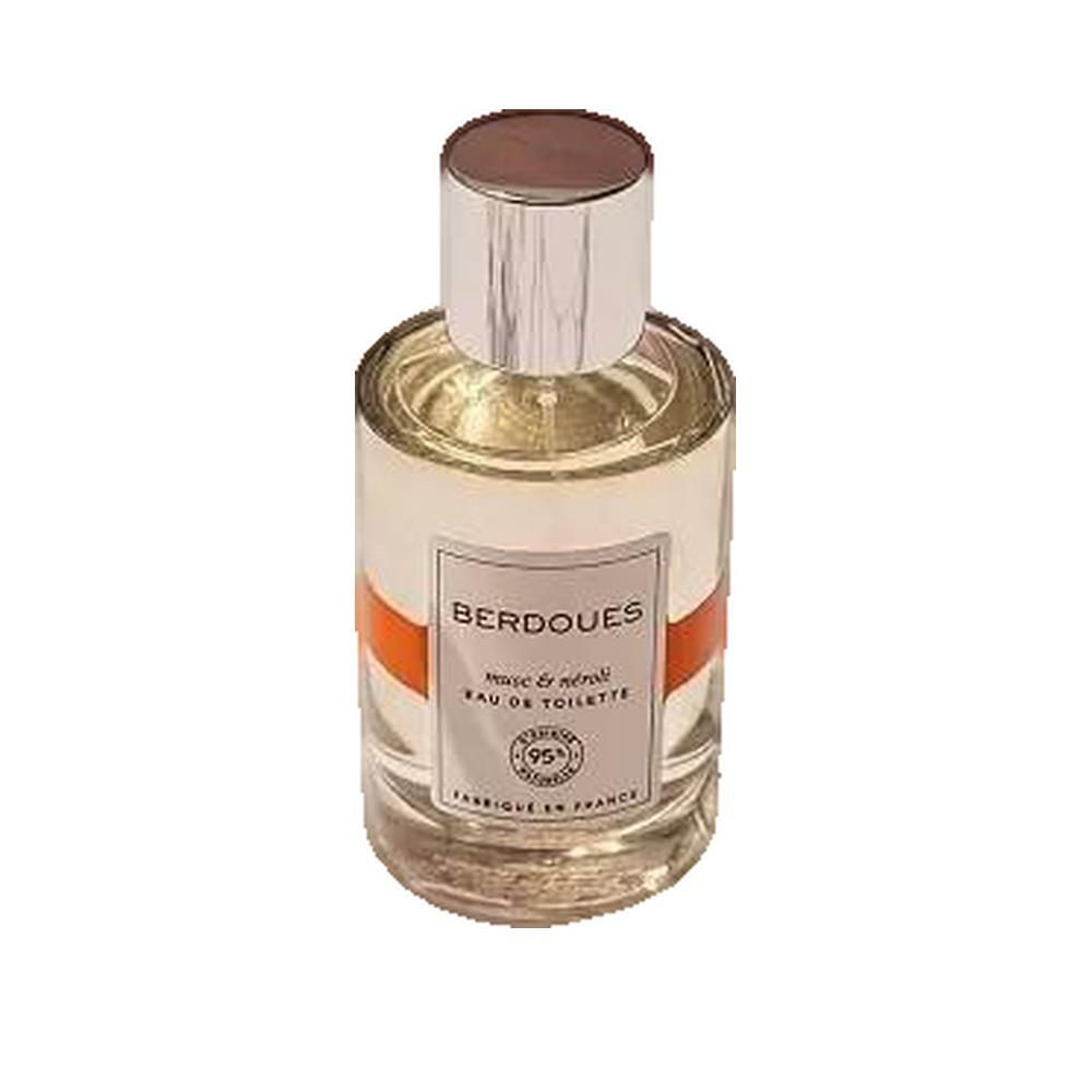 Parfumfles met zilveren dop, wit etiket en oranje band. Opschrift: BERDOUES, musc & néroli, Eau de Toilette.