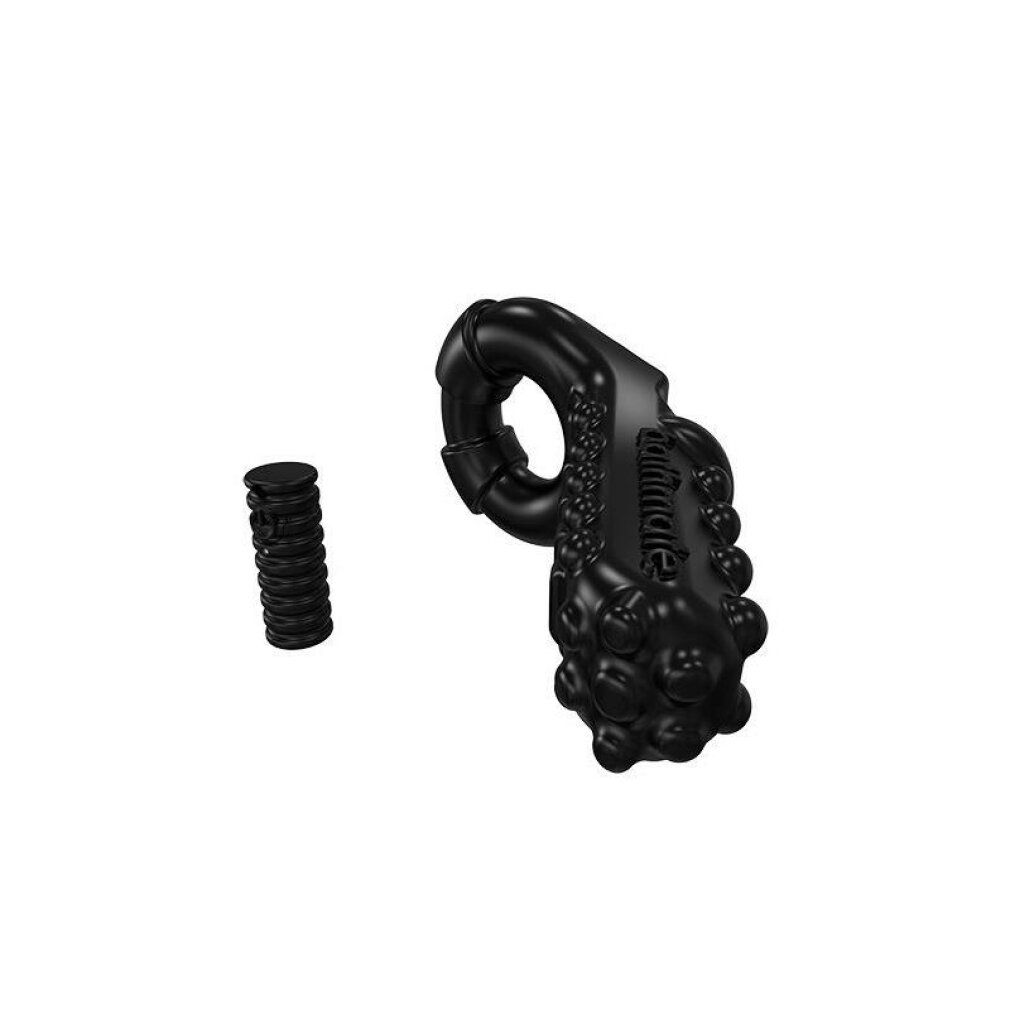 Zwarte penisring met noppen en een apart cilindrisch element.