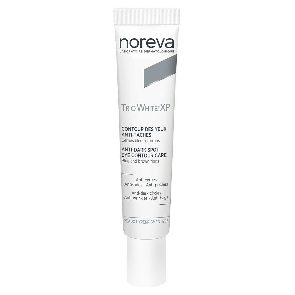 Witte tube met tekst. Opschrift: Noreva, Trio White XP, Anti-Dark Spot Eye Contour Care. Voor donkere kringen en wallen.