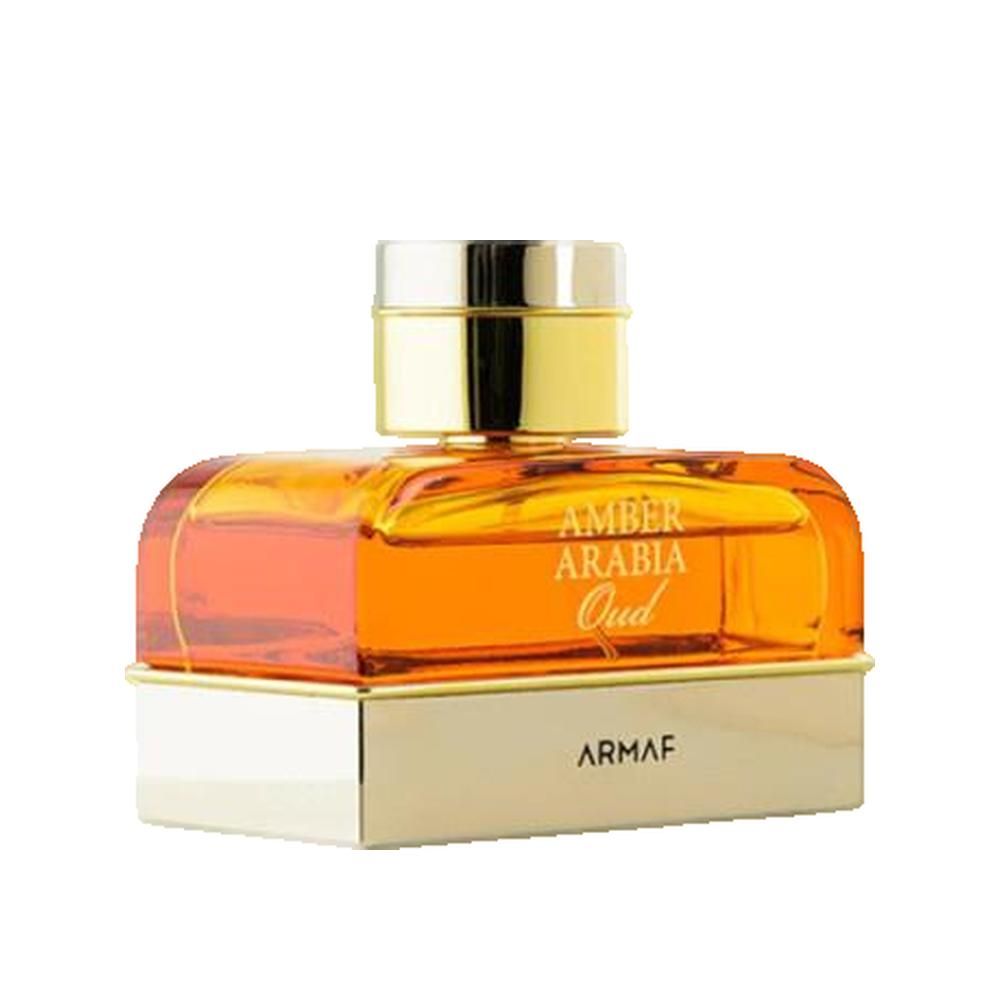 Flacon de parfum avec bouchon et base dorés. Inscription: Amber Arabia Oud, Armaf.
