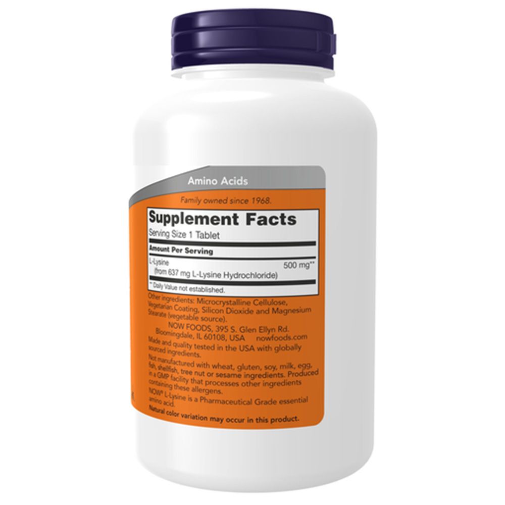 Flacon blanc avec bouchon bleu. Étiquette avec informations produit : Now Foods, L-Lysine, 500mg. Contient informations nutritionnelles et ingrédients.