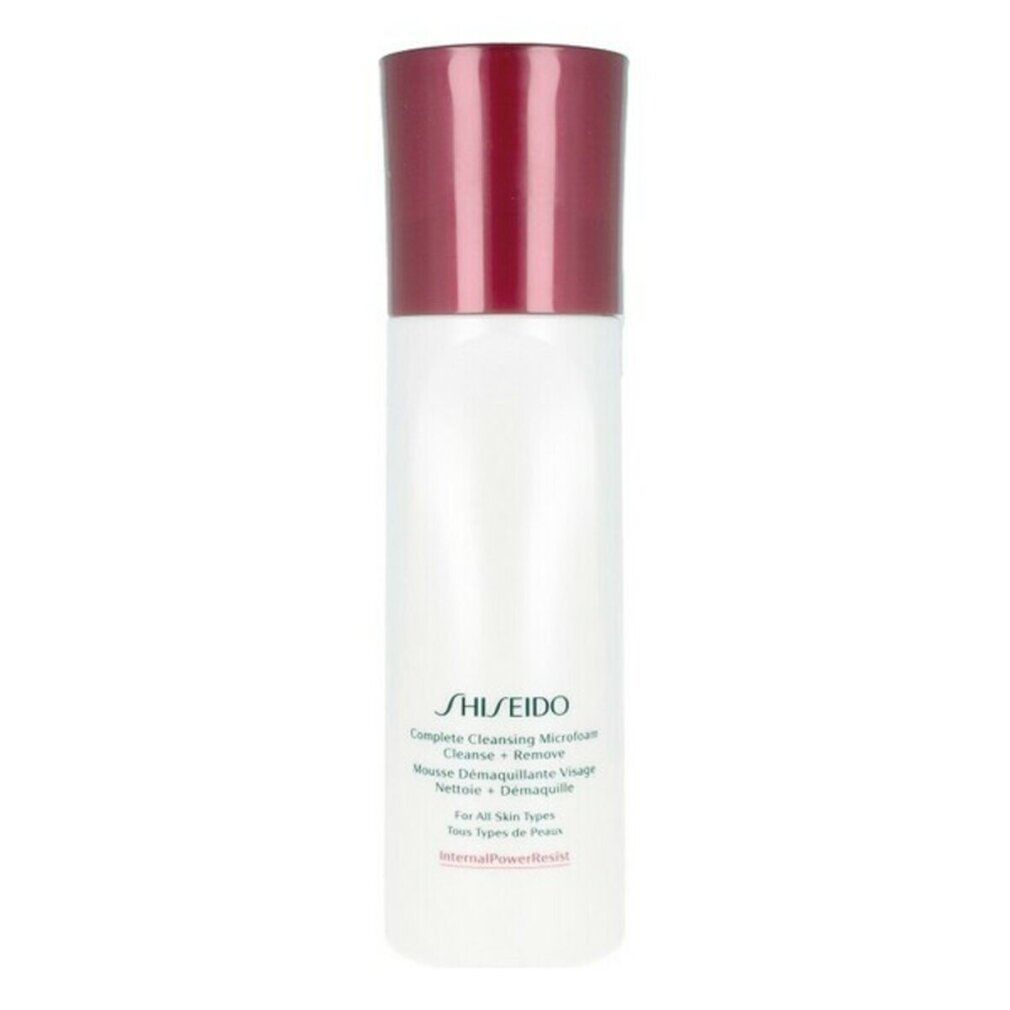 Flacon blanc et rouge Shiseido Microfoam nettoyant. Forme cylindrique, bouchon rouge. Texte: Complete Cleansing Microfoam.