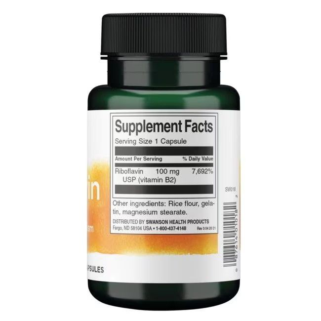 Achterkant van de groene fles. Opschrift: Supplement Facts. Bevat riboflavine 100 mg. Andere ingrediënten: rijstmeel, gelatine, magnesiumstearaat.