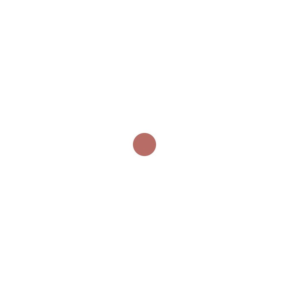 Tache de rouge à lèvres rose sur fond blanc.