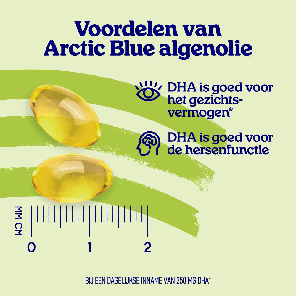 Twee gele algenolie capsules naast een millimeter schaal die de grootte aangeeft.