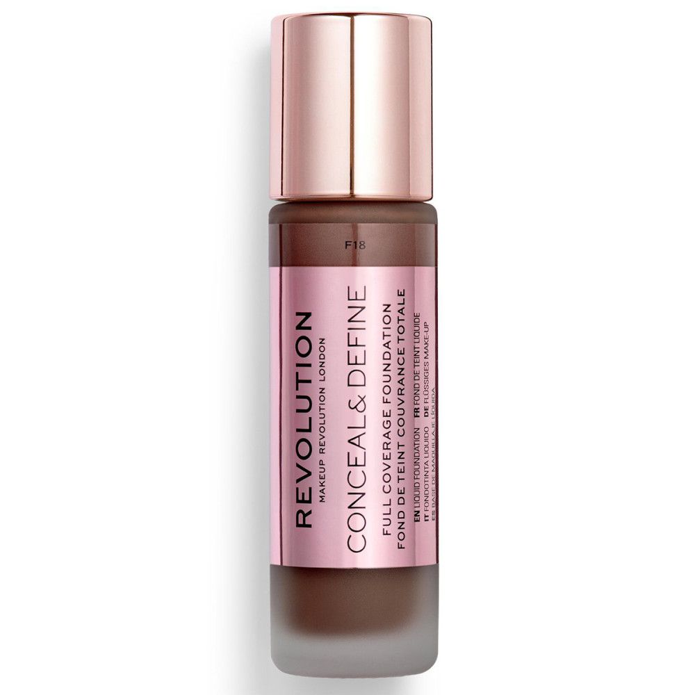 Flacon de fond de teint avec étiquette rose. Nom du produit et marque clairement visibles. Couleur brun foncé.