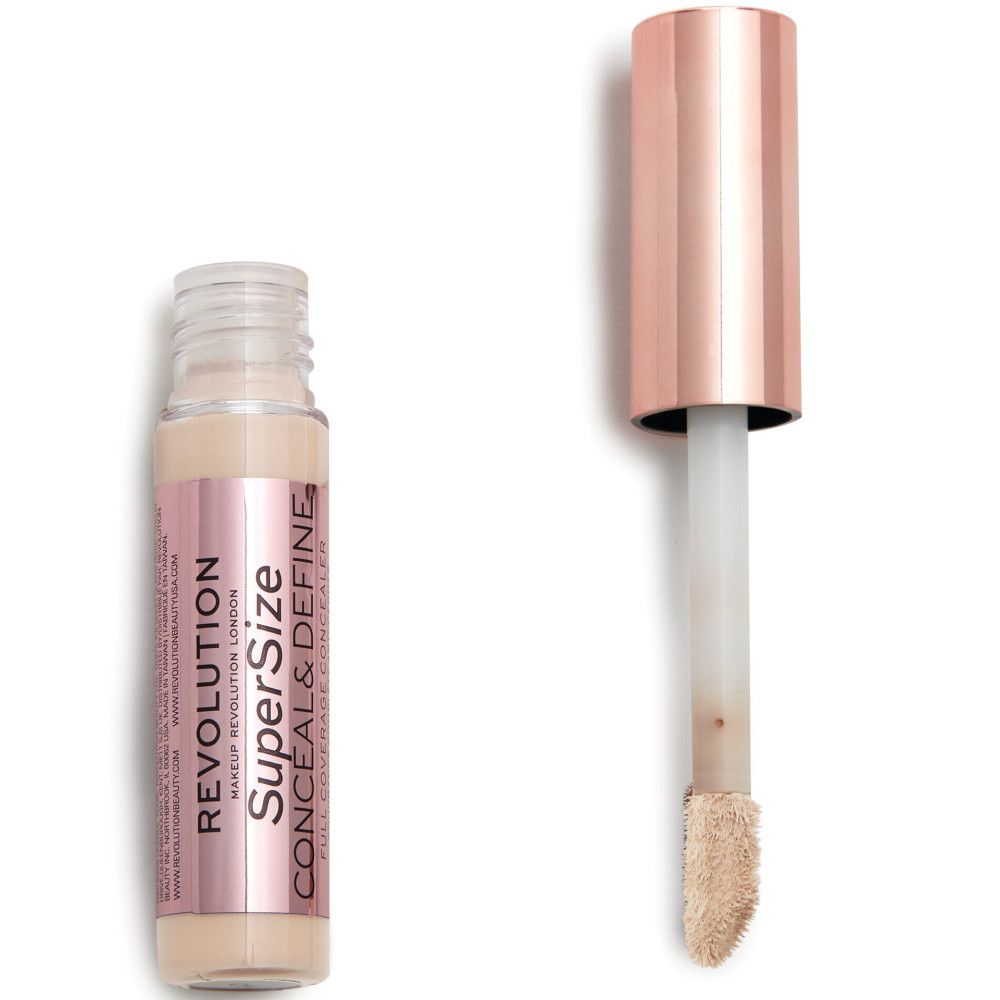 Flacon de correcteur avec applicateur. Étiquette rose avec nom et marque.