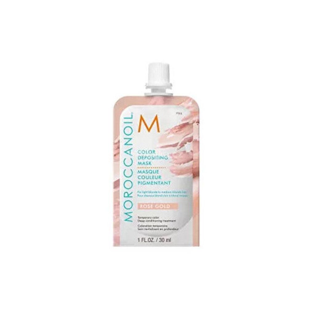 Petit emballage rectangulaire avec bouchon blanc. Inscription: Moroccanoil, Masque Couleur Pigmentant, Rose Gold. Contenu: 30 ml.