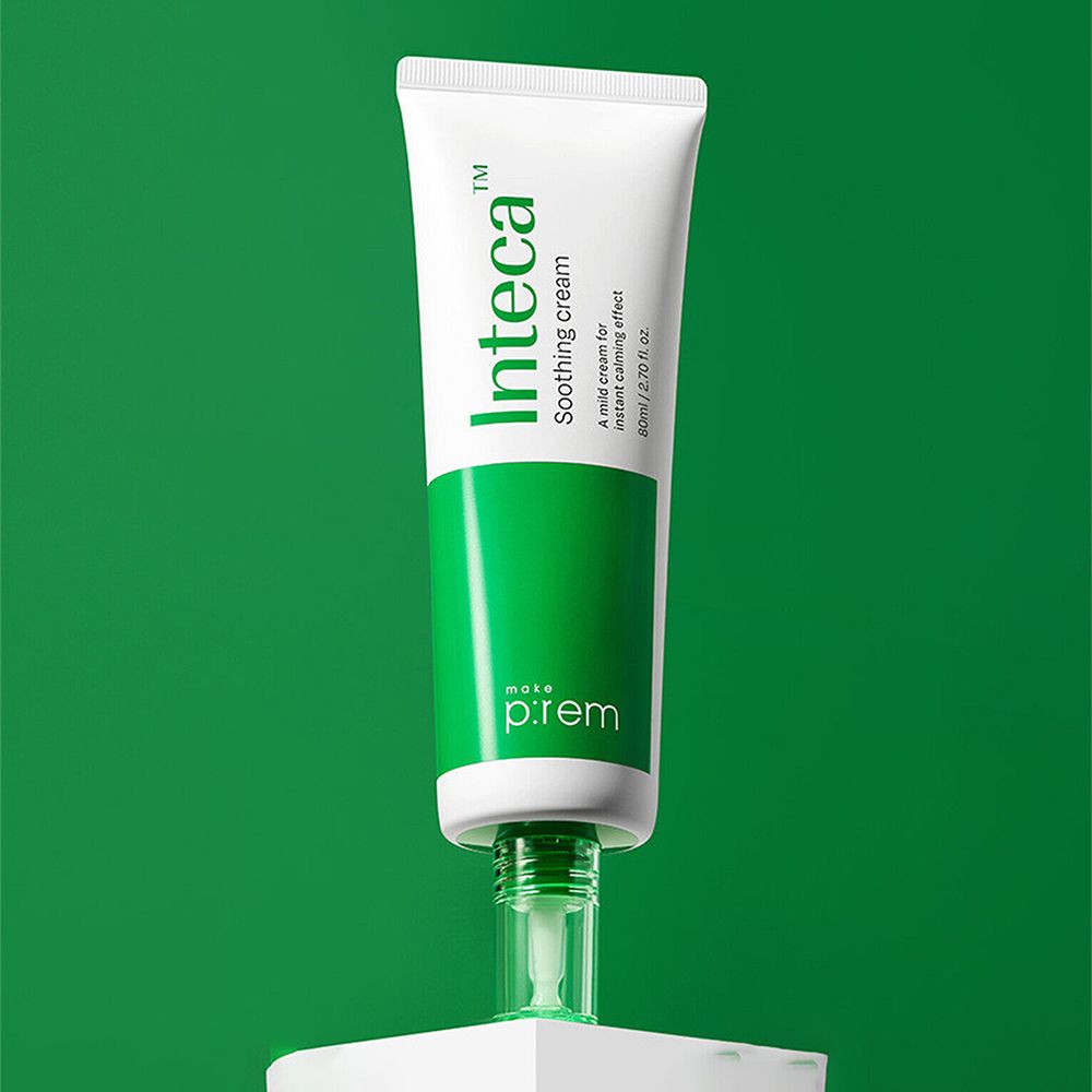 Witte tube met groene streep en tekst 'Inteca Soothing cream'. Op sokkel.