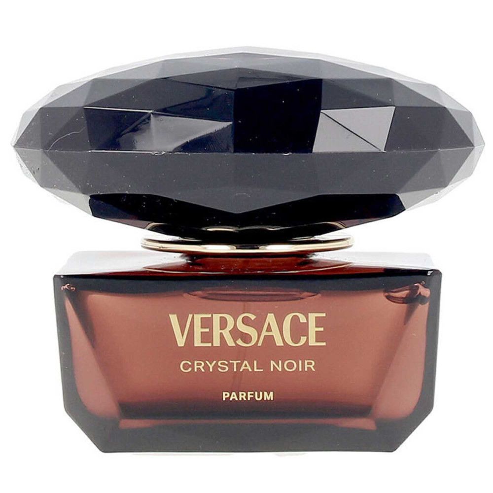 Flacon avec bouchon noir facetté et verre brun. Inscription: Versace Crystal Noir Parfum.