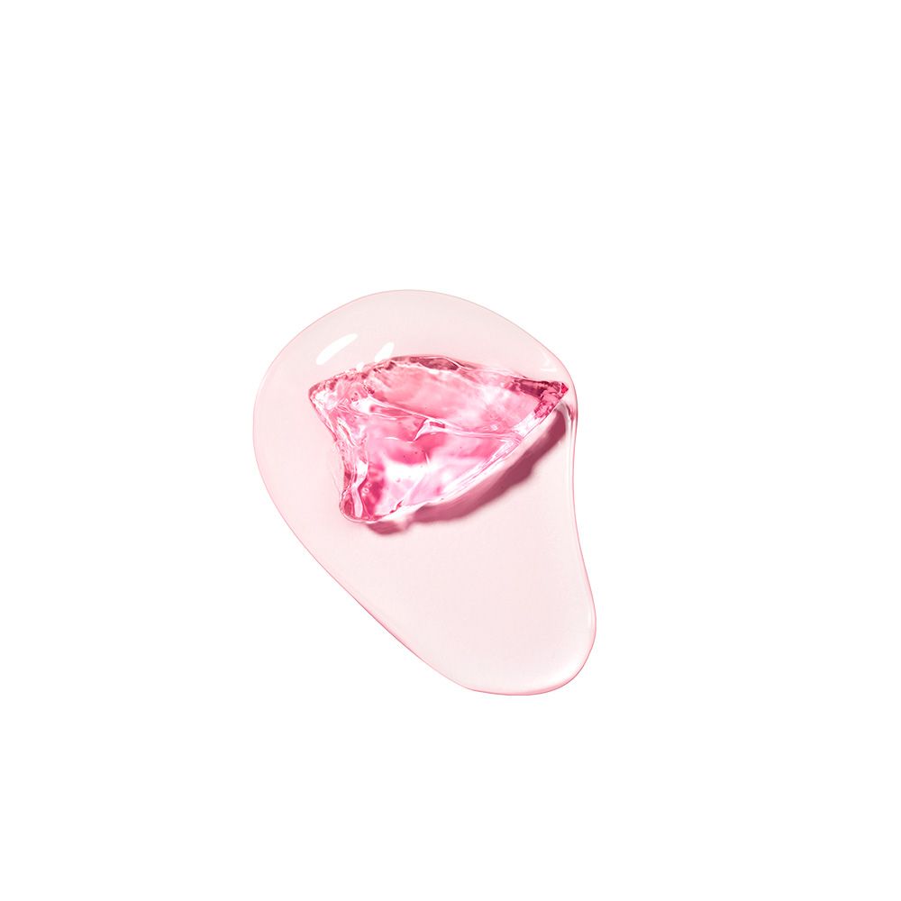 Een roze geltextuur met een facetgeslepen, roze kristal in het midden.