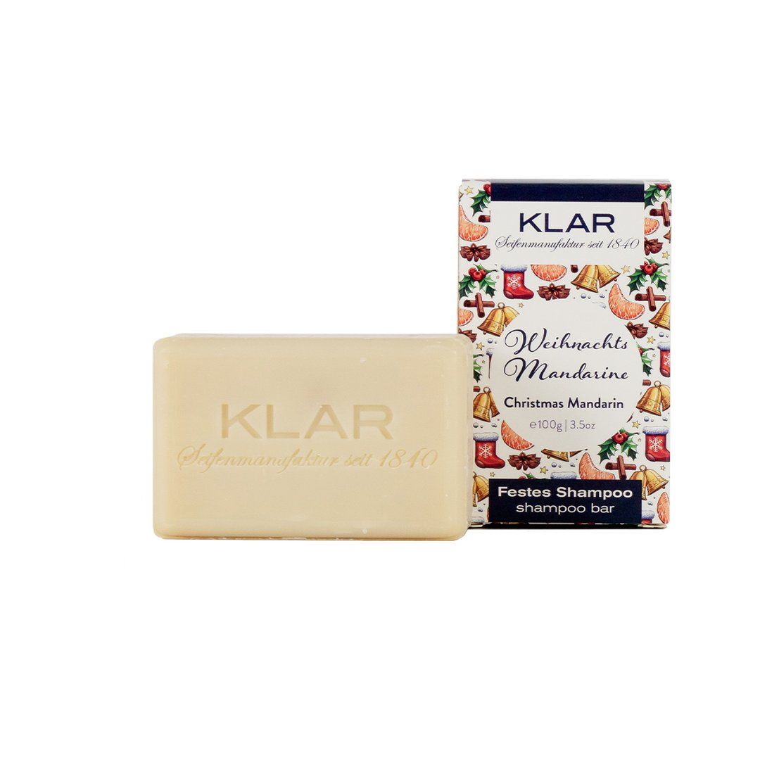Shampooing solide avec logo Klar et emballage. Inscription Weihnachtsmandarine.