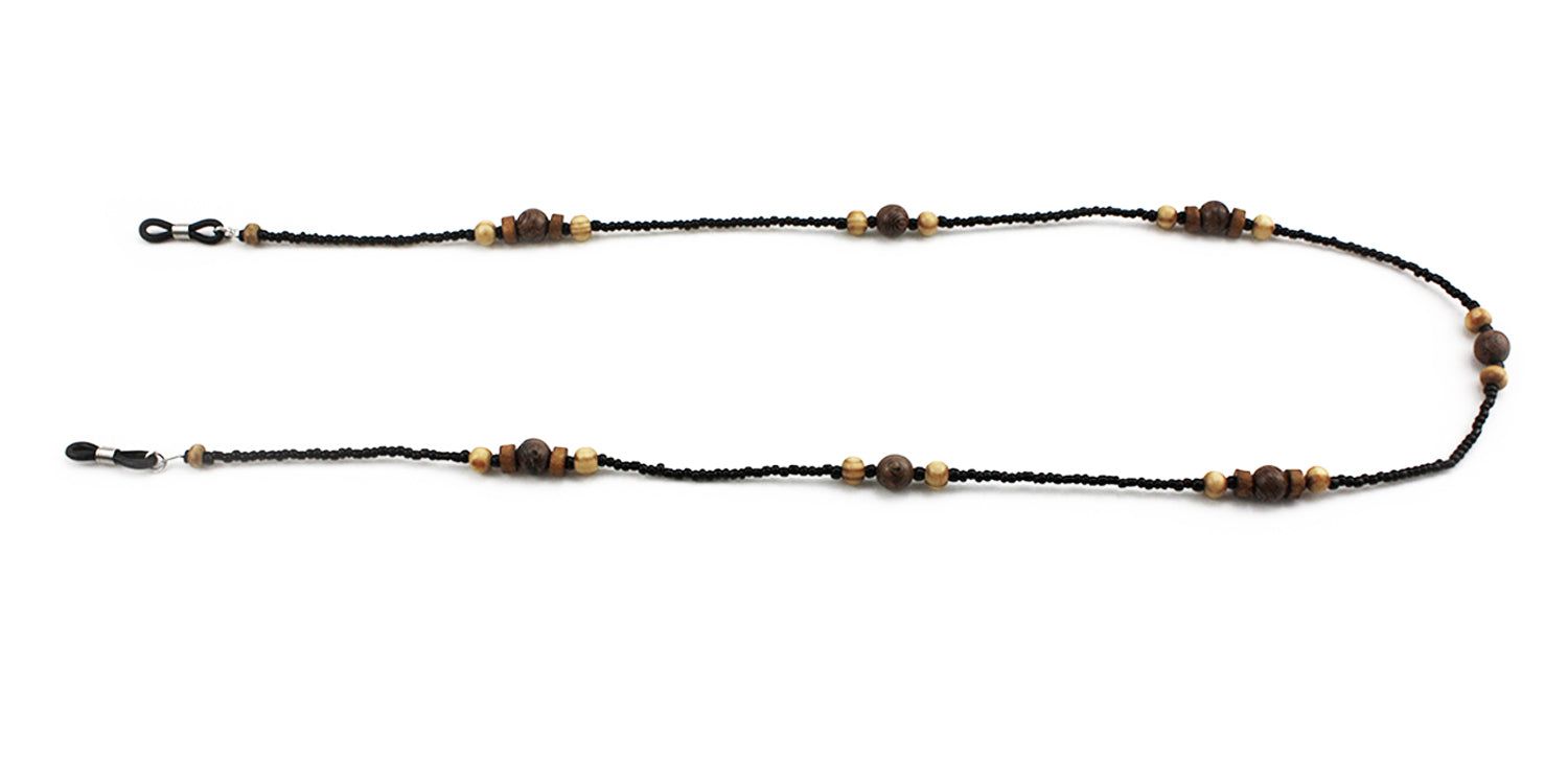 Cordon à lunettes avec perles noires et perles en bois. Le cordon a des boucles pour attacher aux branches des lunettes.