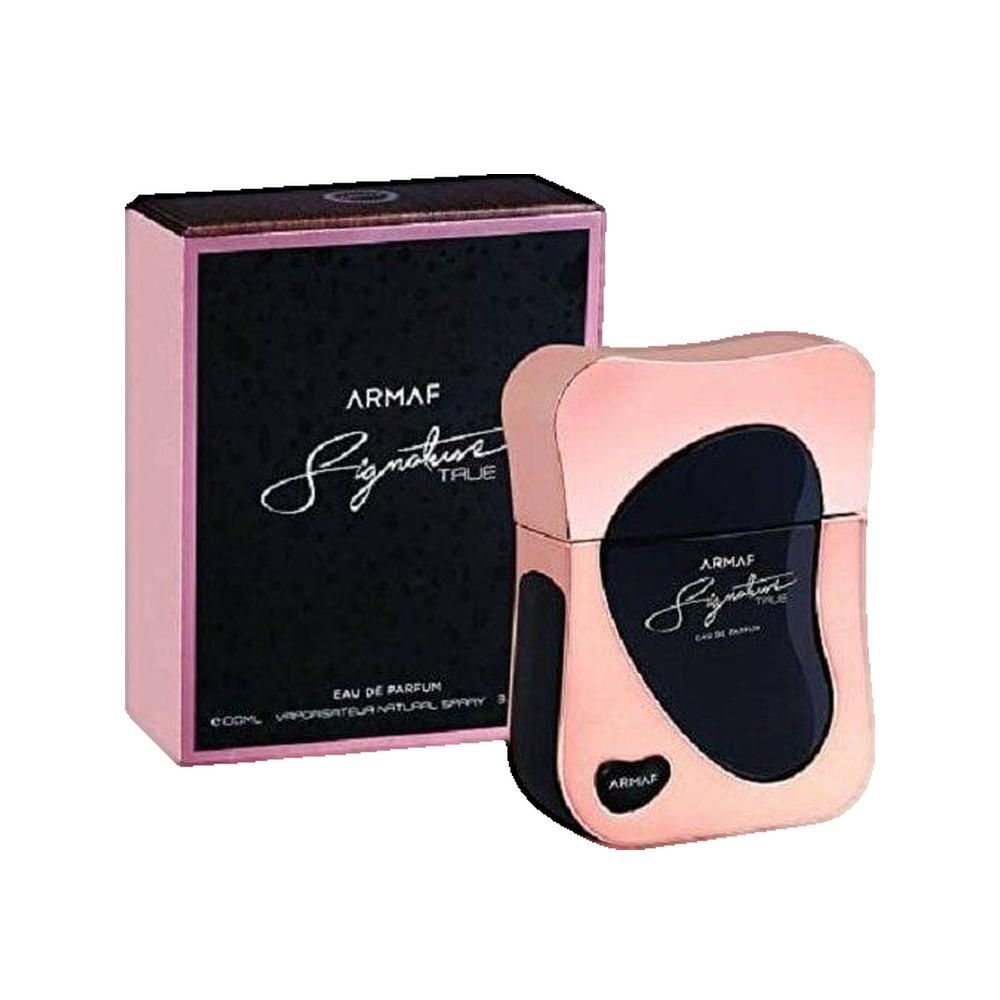 Parfumfles en verpakking. Roze-gouden fles met zwarte inzet. Zwarte verpakking met roze rand en belettering.