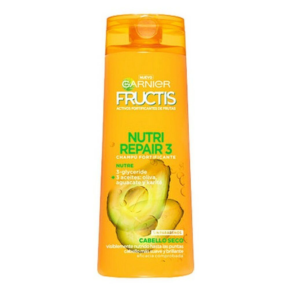 Flacon de shampooing jaune avec logo Garnier Fructis et texte. Illustration d'avocat. Inscription : Nutri Repair 3, Cabello Seco.