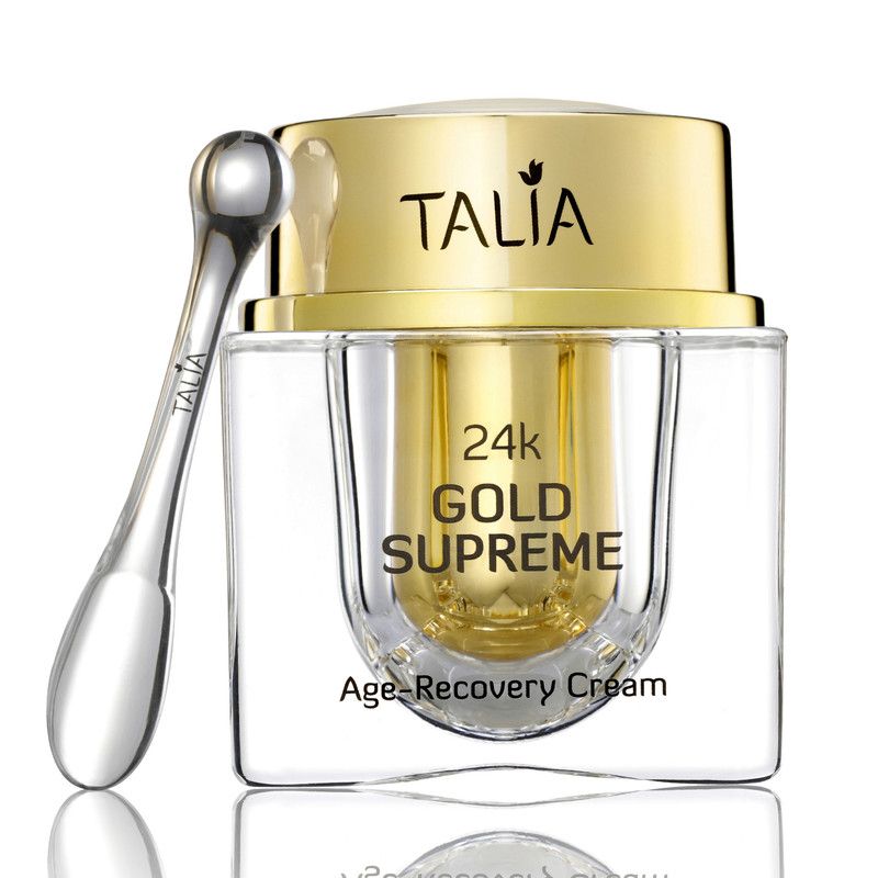 Een potje 24K Gold Supreme Age-Recovery Cream, met een gouden spatel.