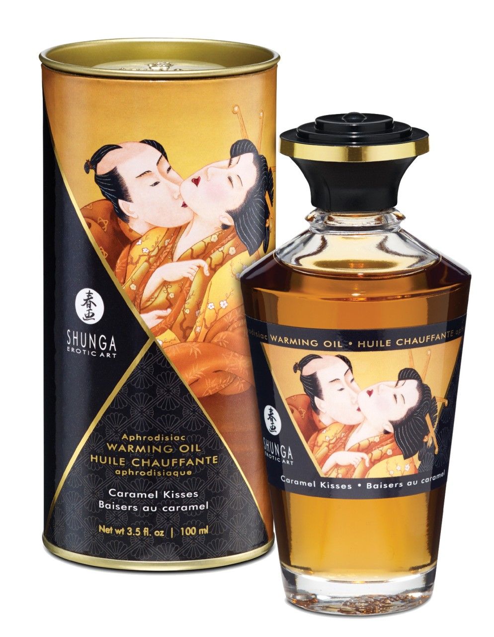 Cilindrische verpakking en fles met etiket. Opschrift: Shunga, Warming Oil, Caramel Kisses. Illustratie: kussend paar.